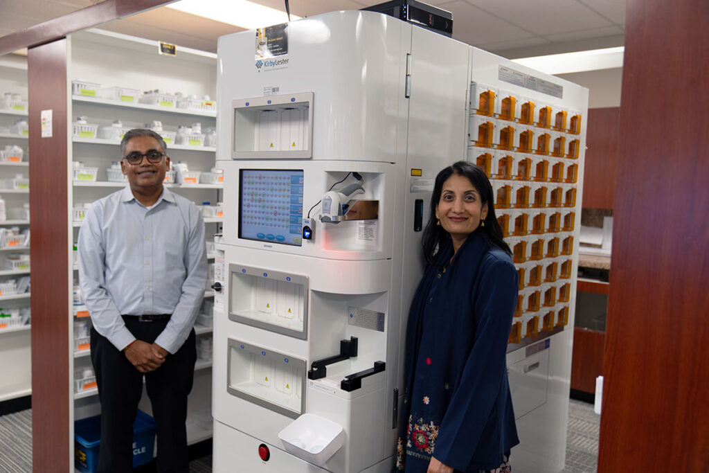 Dr. Hetal Patel, UCF Health Student Health Services pharmacy manager and Dr. Binita Patel, pharmacist, pose with Pillbert. 