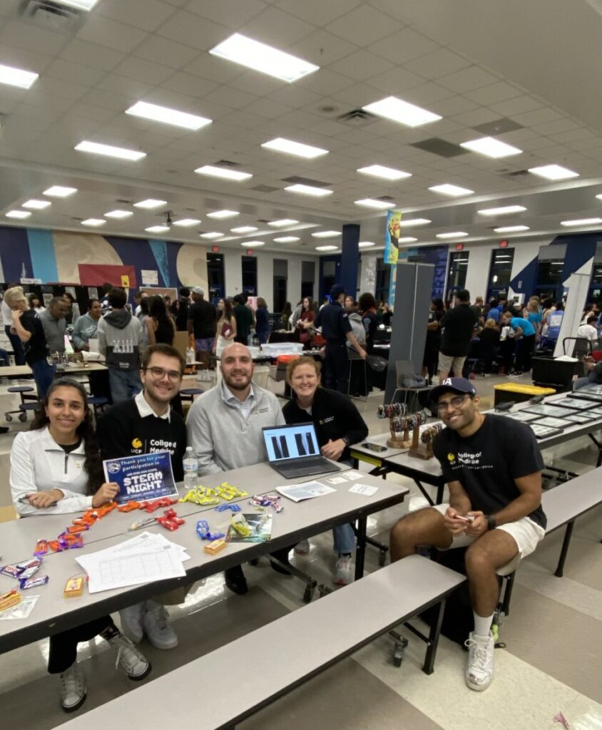 Primary Care Scholars set up a table at the Lake Nona High School STEAM event in November 2025.