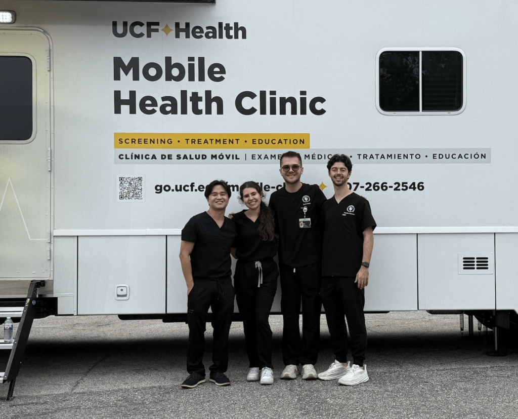 PCP Scholars in front of UCF Mobile Clinic RV. 