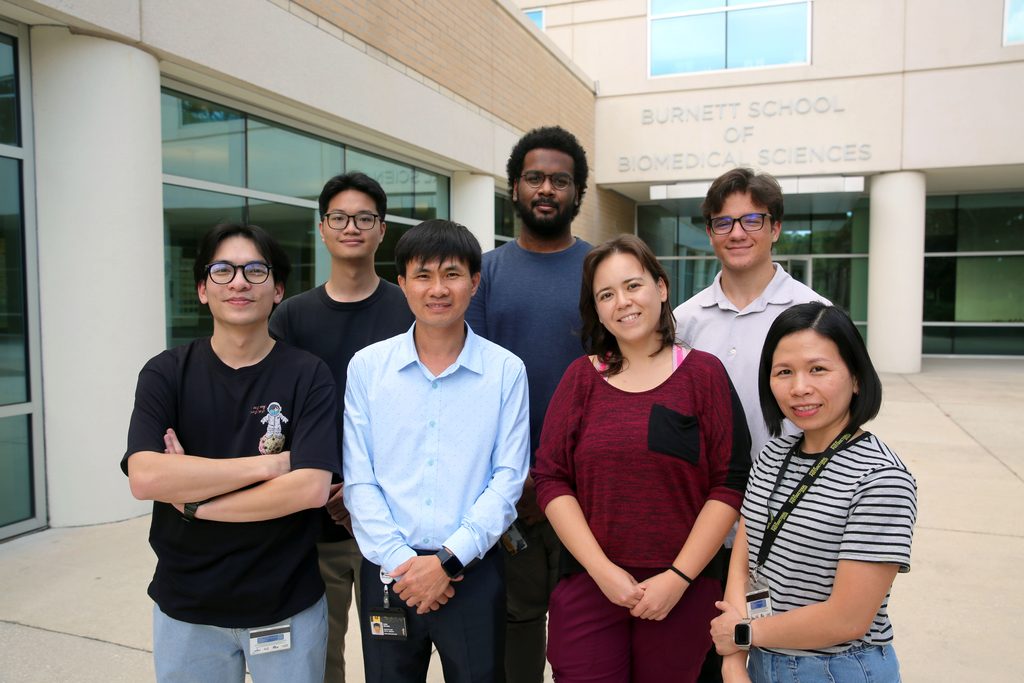Dr. Nguyen and his lab group outside